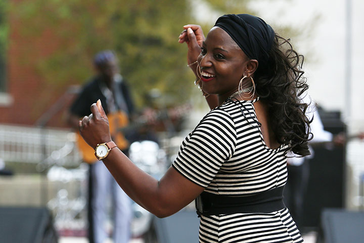 A woman dances to Oliver Mtukudzi, a Zimbabwean musician, at Jefferson Community and Technical College.