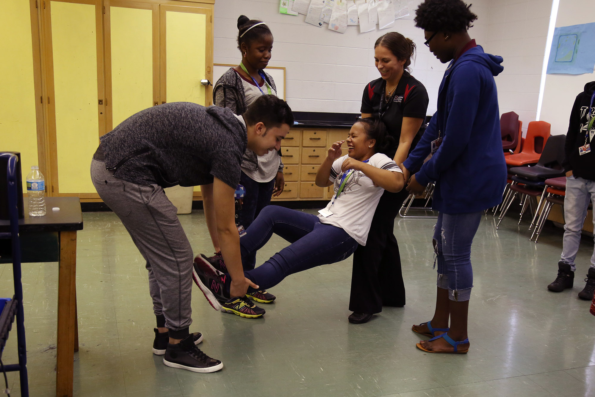  Students at ESL Newcomer Academy work on making shapes with dance and theater organization, Pilobolus. 