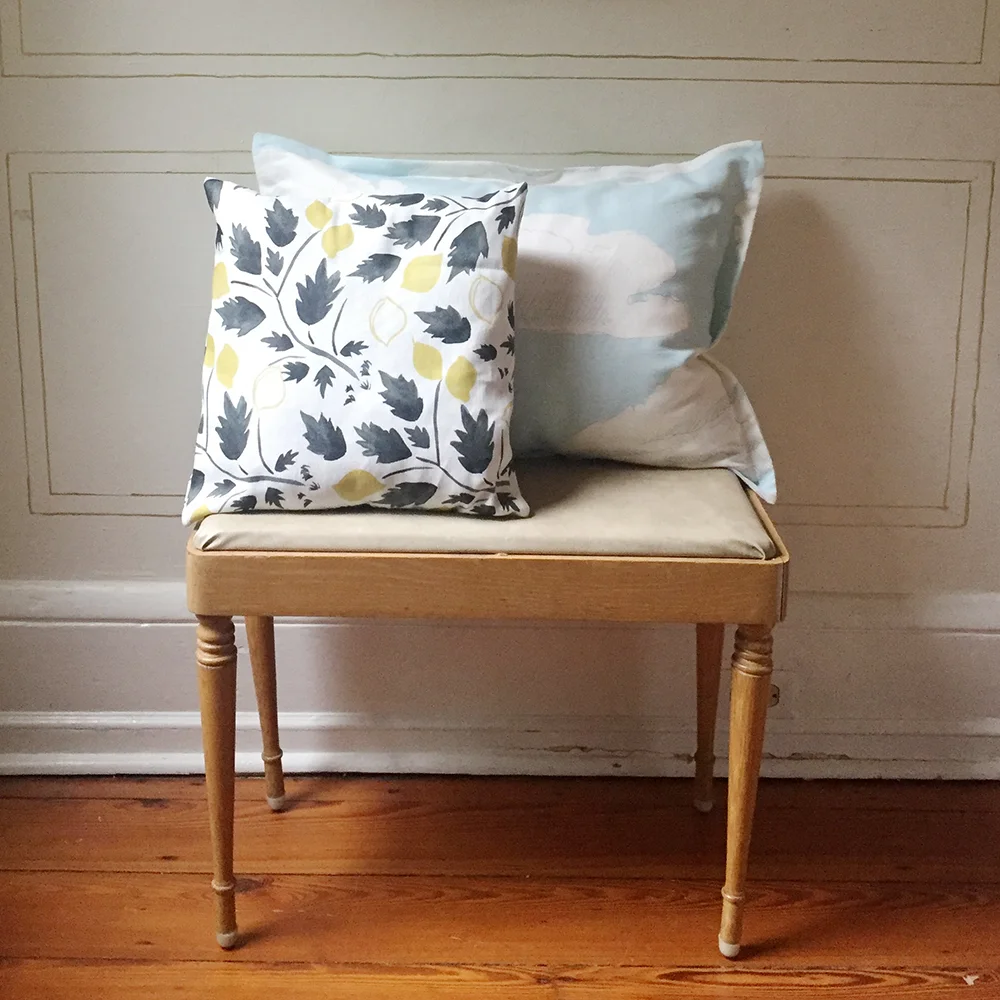 Our Lemon Grove & Partly Cloudy fabrics made up as throw pillows.
