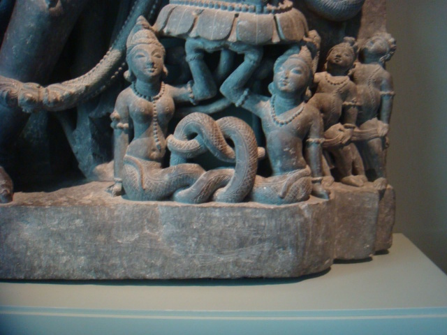 I liked the way that these two serpent people, a man and a woman, had their tails wrapped around and holding each other tenderly. You can't see it, but they are holding up a foot of a deity 20 times larger than they are.