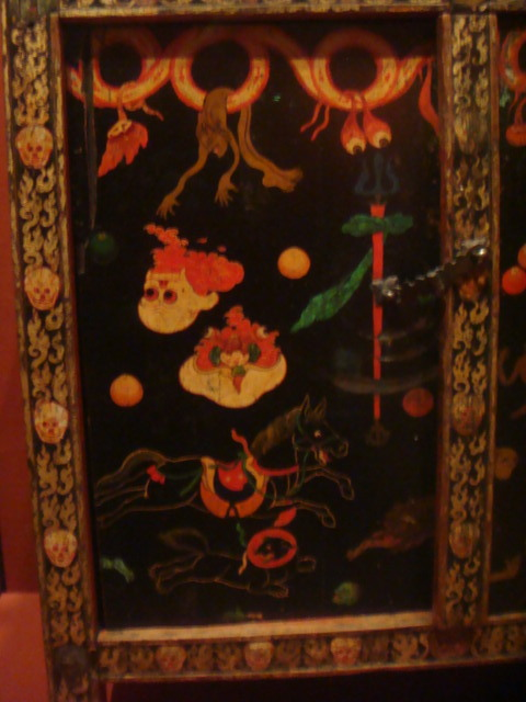 This was a wooden chest with a bunch of gorey images on it.