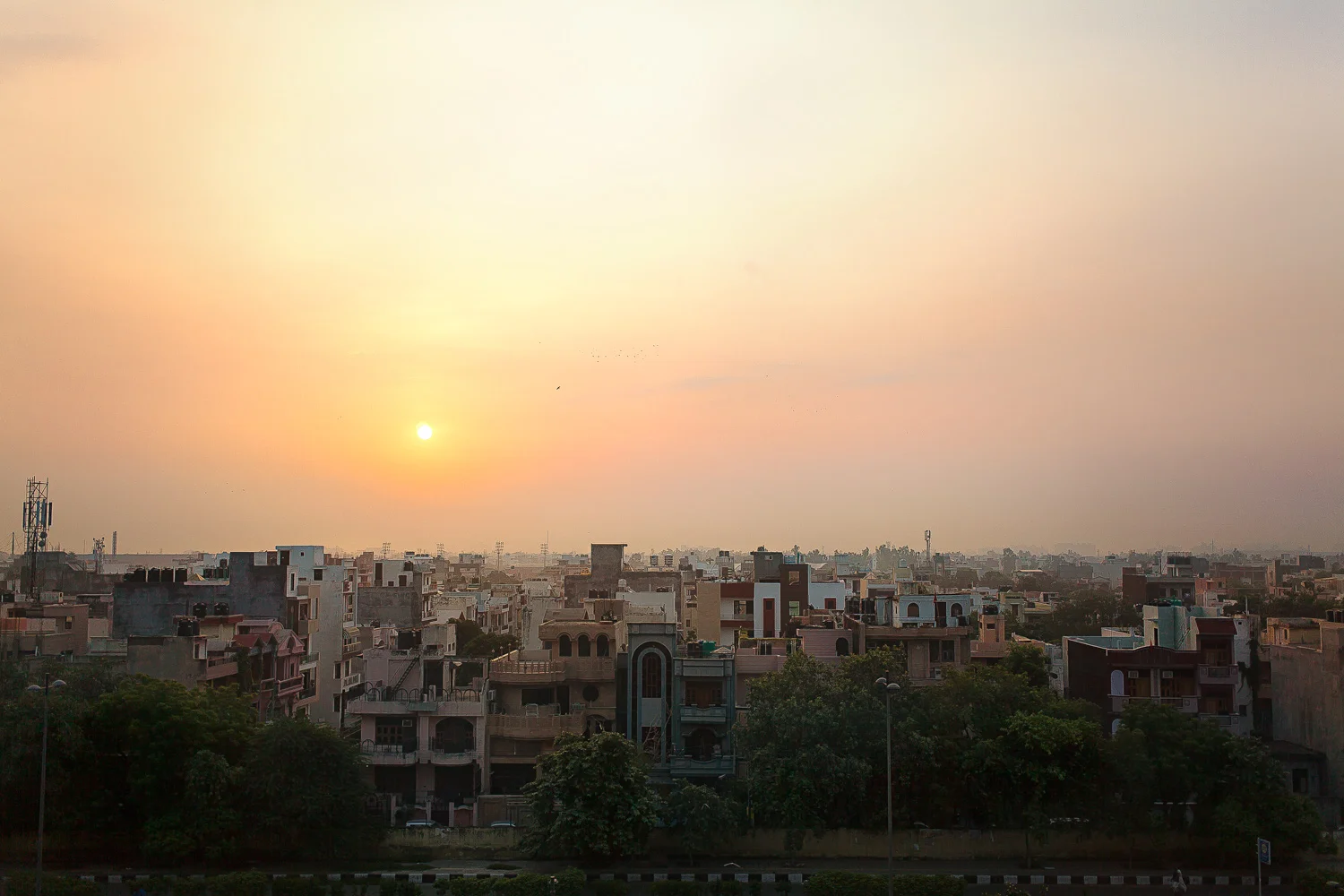 Tired morning. 4AM morning shoot of a lobby complete, I saw the sun coming up over Delhi. Pollution does makes some impressive colors... Travel is getting tiresome. In the mood for a sandwich and a root beer on my own couch. 