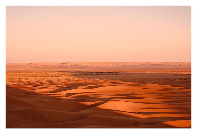 One of the most magical places on earth: sitting on a massive sand dune watching the last rays of the day recede; when the fiery copper dunes become black mountains silhouetted against the starriest sky you&rsquo;ve ever seen ✨ (shot on assignment wi