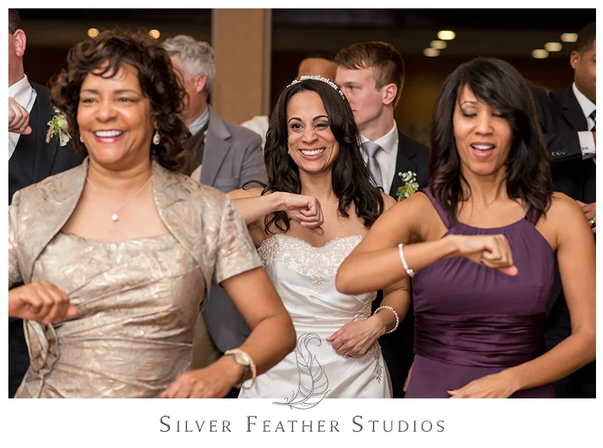Instructor teaches guests a special dance at this Bryan Park Golf Center Wedding reception. © Silver Feather Studios, Wedding Photography in Greensboro, North Carolina.