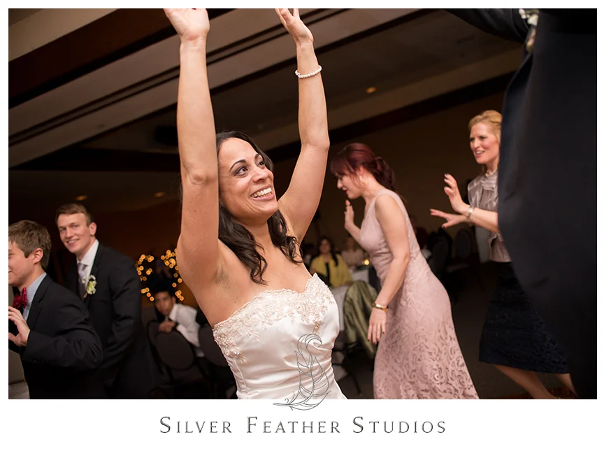 Instructor teaches guests a special dance at this Bryan Park Golf Center Wedding reception. © Silver Feather Studios, Wedding Photography in Greensboro, North Carolina.
