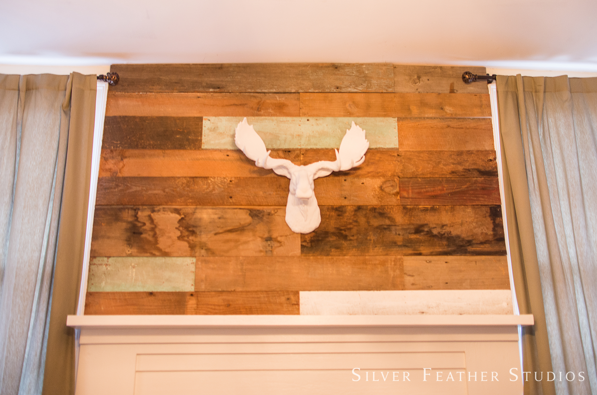 The Groom's suite features an antler wall ornament at the Mims House, a chic approach to Southern.