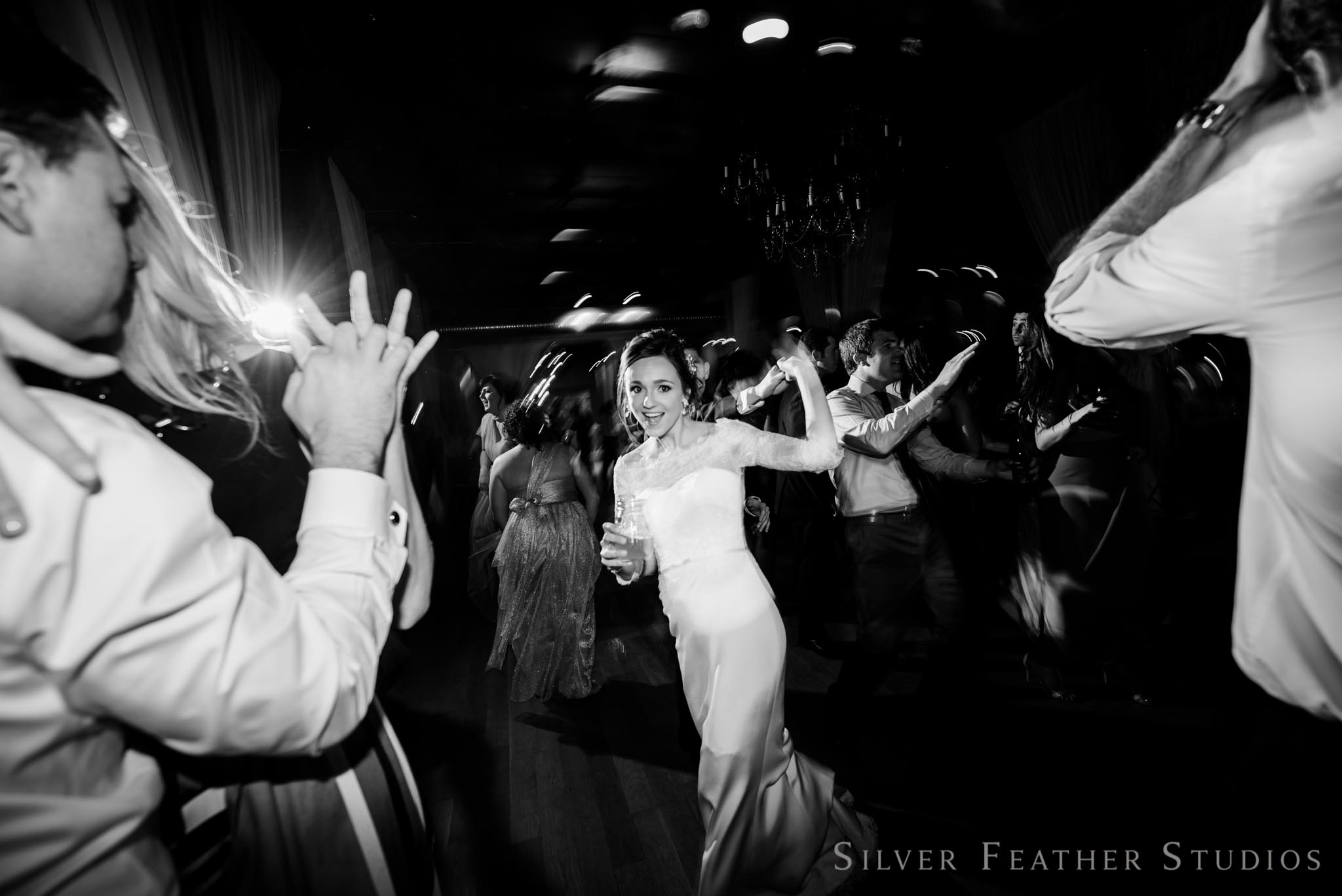 fun and spontaneous moments at this cotton room reception. © silver feather studios