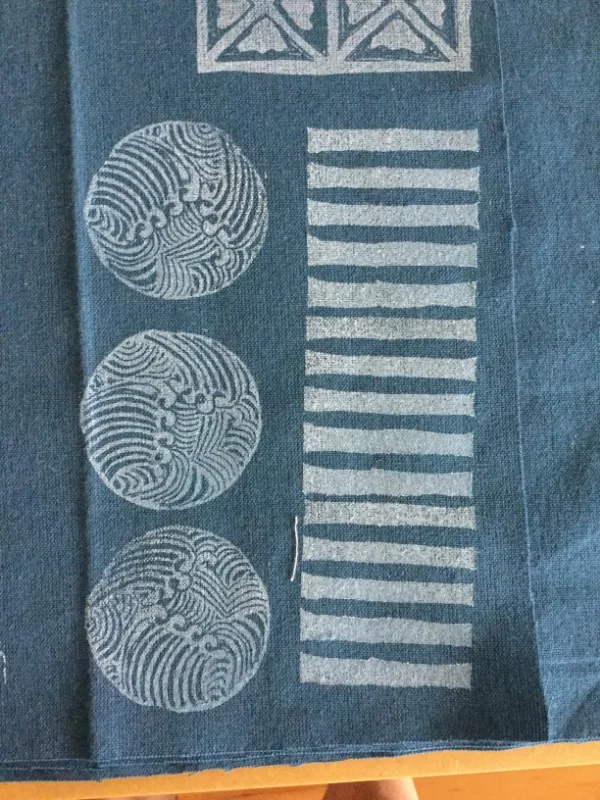 Robin plays with fabric design. 