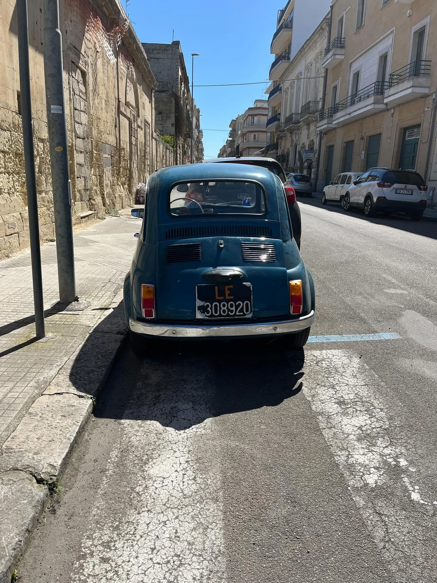 This picture is one of my favorite memories from Italy.

We were walking along the streets of Lecce and I was lagging behind absorbing architecture, graffiti, and people.

Ahead of us, this little blue Fiat pulled into a parking space by the crosswal