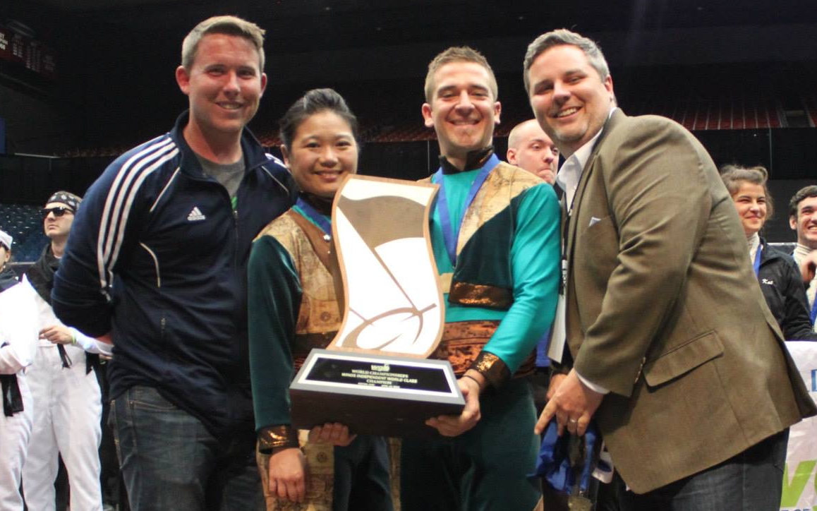 Stephen Mason (far left) and Jimmy Blankenship (far right) pose with X16 Winds cast members after their inaugural world championship.