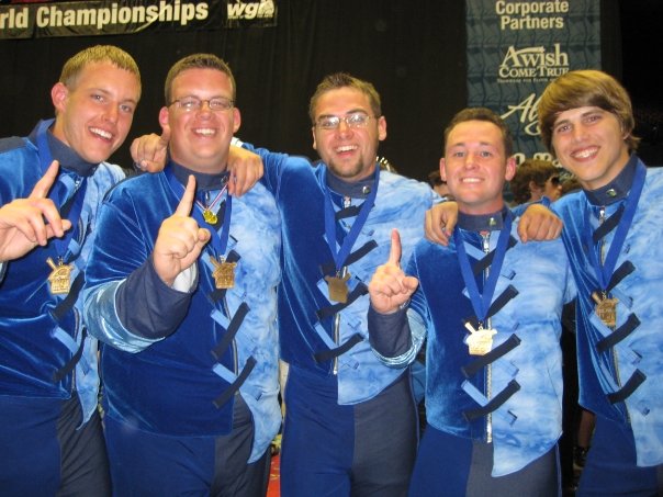 Jules Scogna (#196), second from right, poses with other marimba players after Rhythm X won the PIW Gold Medal in 2009.