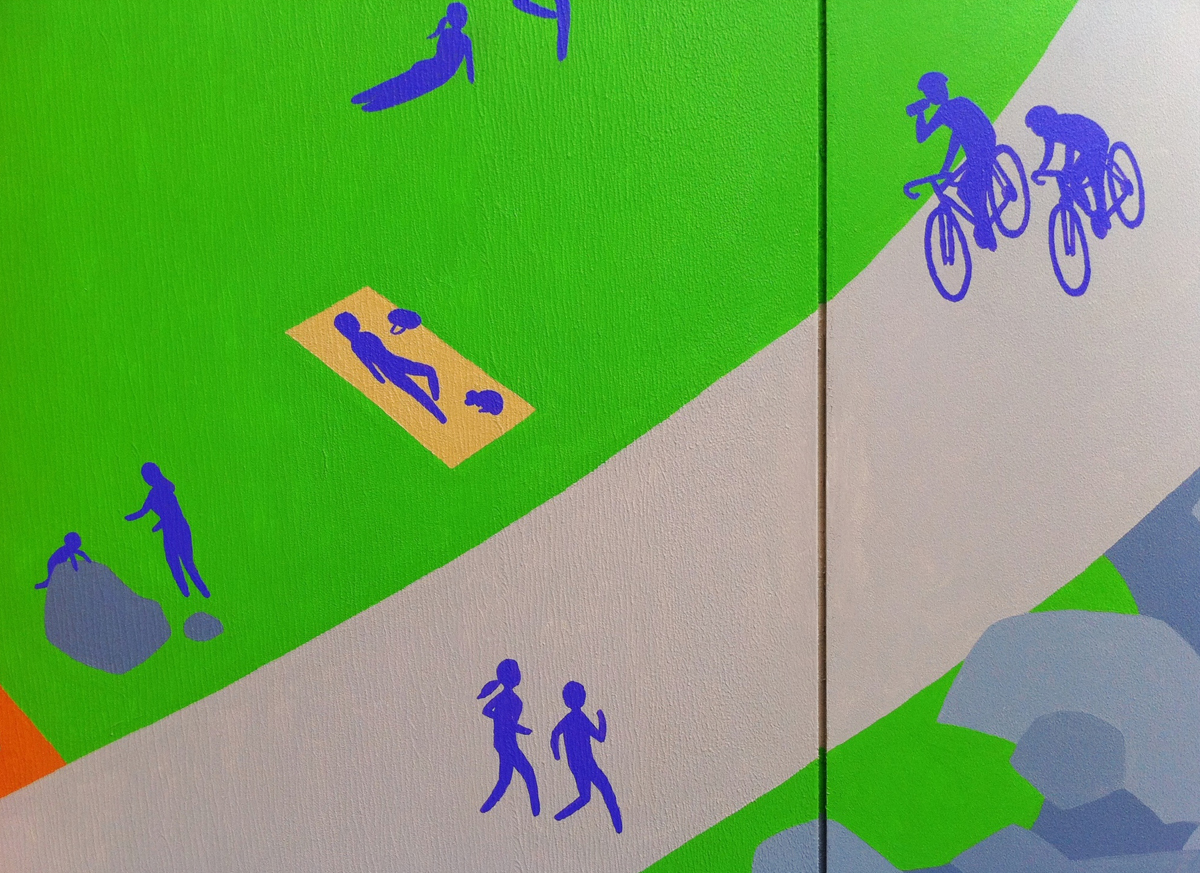 Runners and cyclists on the busy path.