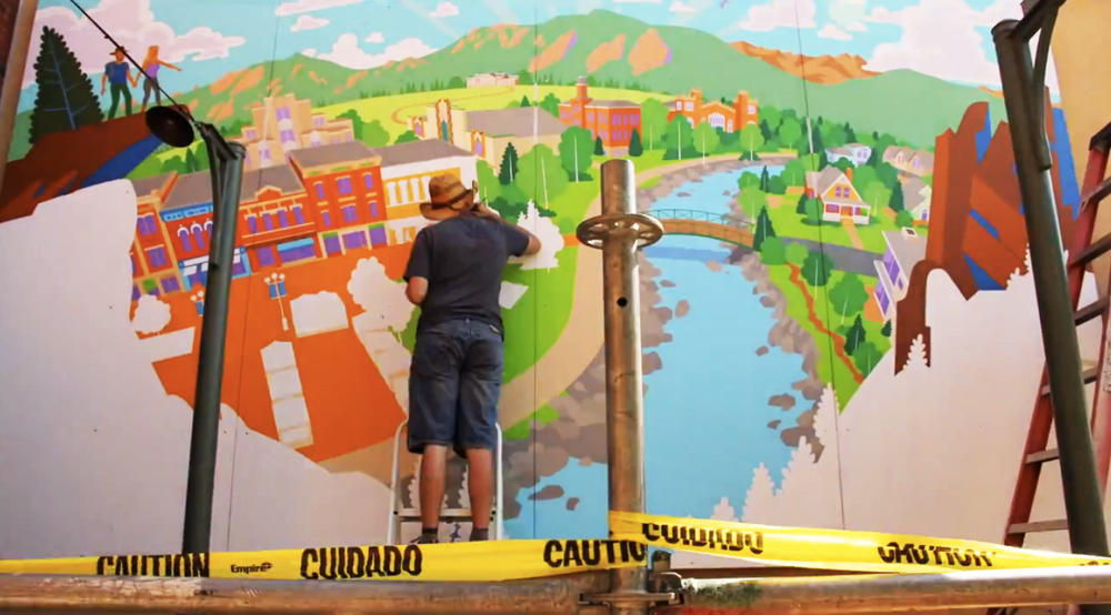 Here I am painting details on the wall with a small brush.