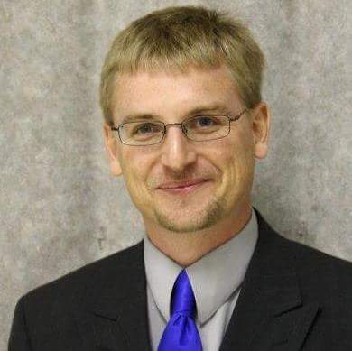 John C. Ackerman, Director of Media Relations