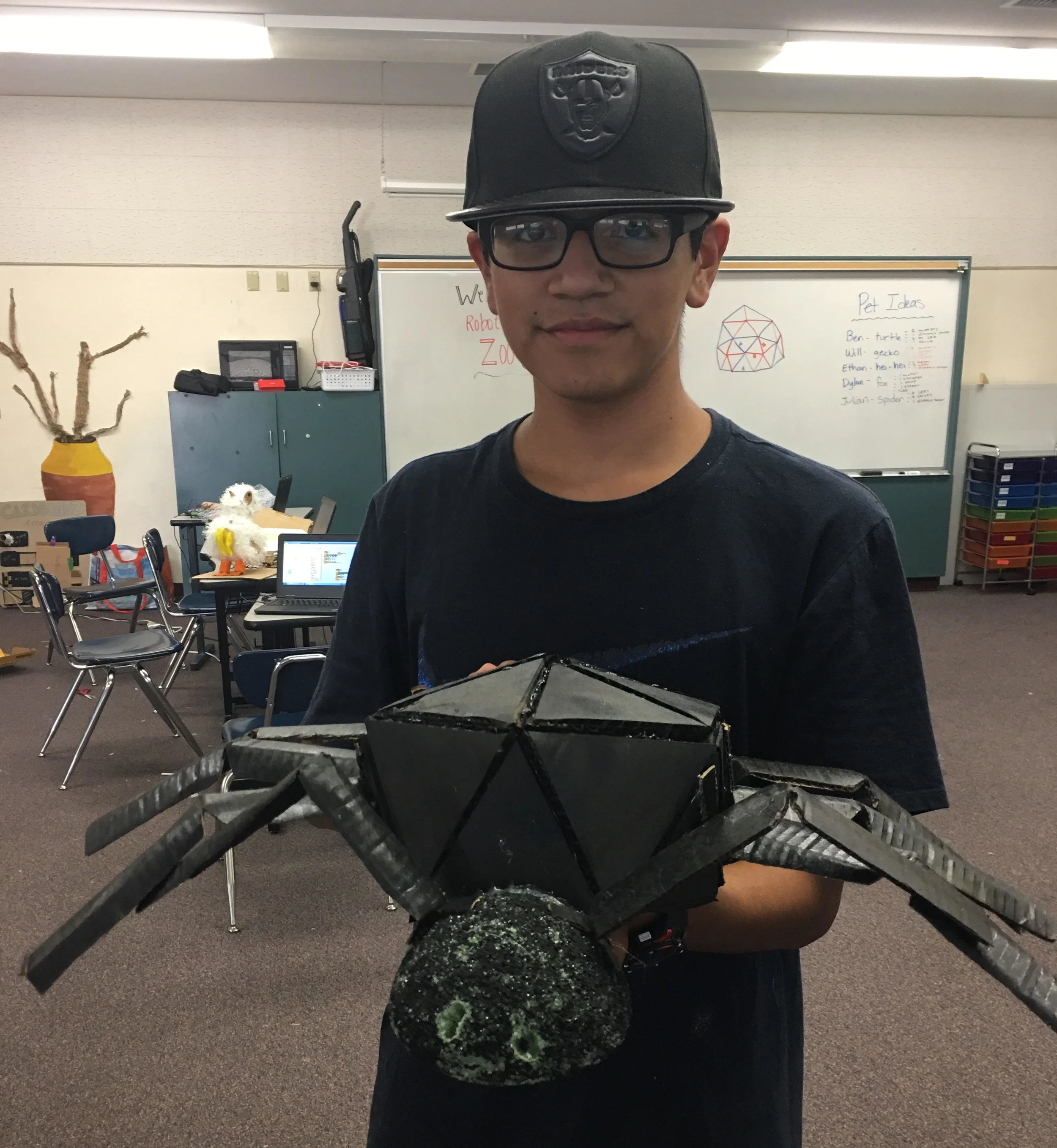 One of our students with his Animatronic Spiders.
