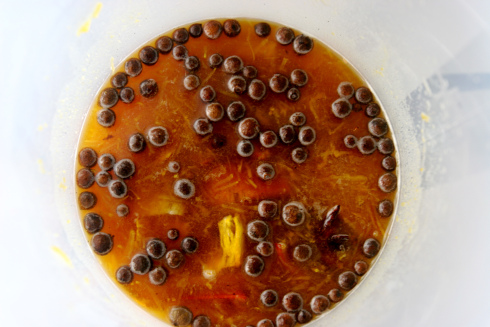 Step two: Add rum and cooled roasted pumpkin. Using a muddler or a large spoon, smash the pumpkin and liquid until you have a nice soupy consistency. Step three: Let your mixture sit for one week. Then, use a fine mesh strainer to strain all solids. Step four: Make a simple syrup from equal parts brown sugar and water and add it to liqueur to taste. Step five: Enjoy! Let us know how you mix it!