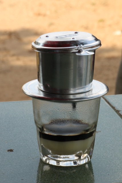 Ca Phe (Coffee) - the start of a love affair. Hot, strong and drip filtered over a layer of condensed milk. Sooo good with a fresh baguette and best drunk when sitting on a tiny little red chair.