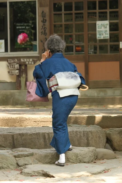 In Matsuyama, Japan at a sacred pilgrimage site - watching a lady in traditional kimono. I thought she was chanting prayers or thanks for having made it to the site. But no, when I got closer, she was talking on her mobile phone.