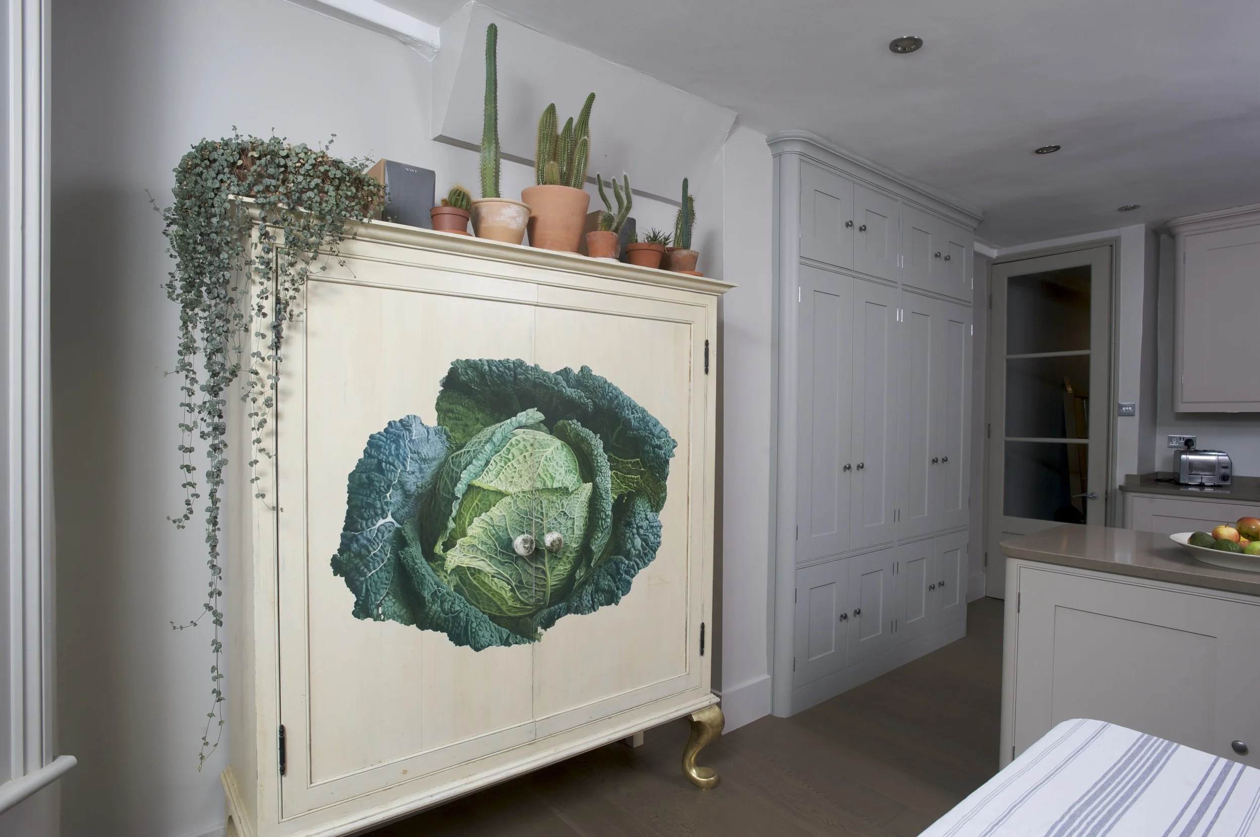 Cabbage motif cupboard in Tim Moss' kitchen