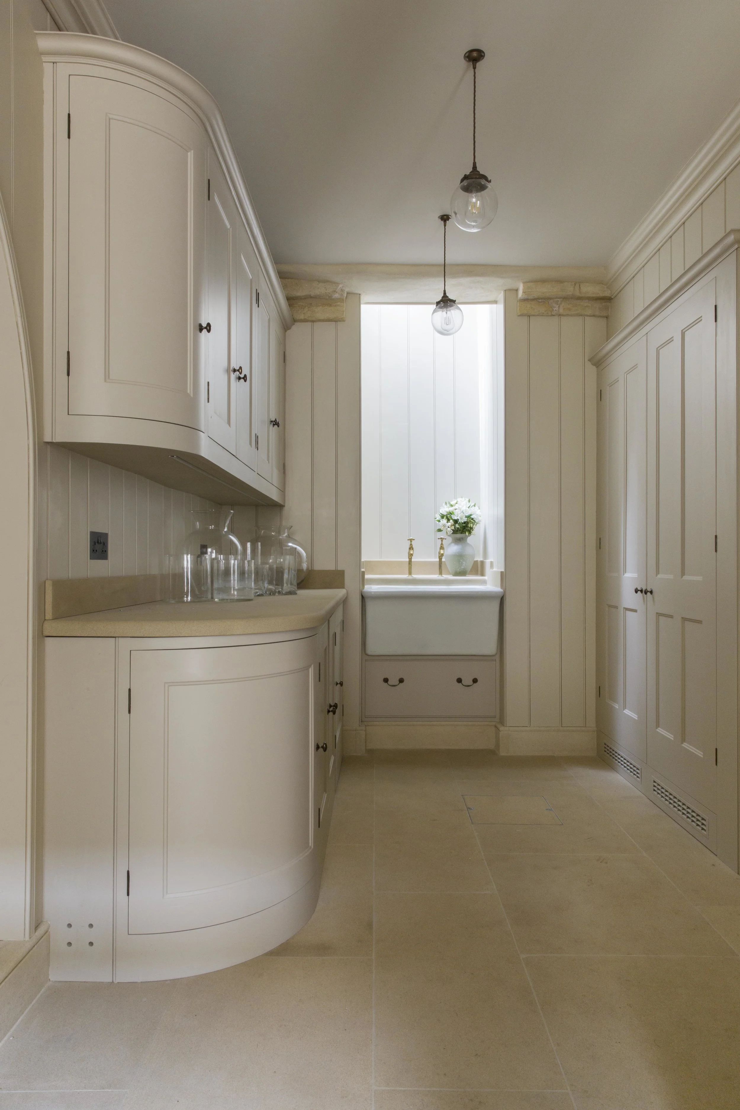 Plain and understated cabinetry bring elegance and simplicity to the utility room.