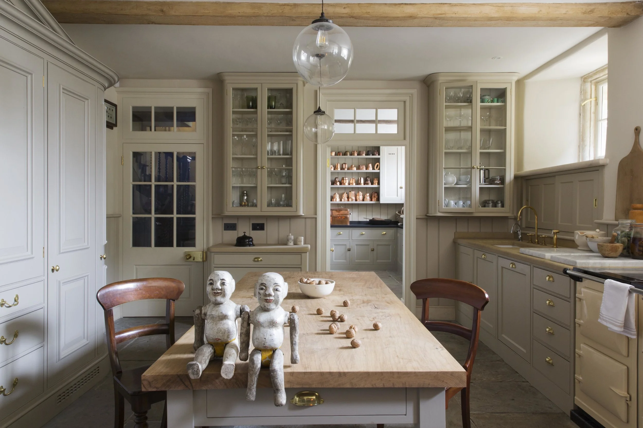 A large wooden dining table takes centre stage.