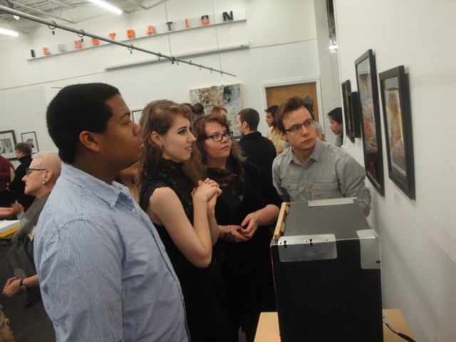 Several juniors checking out the work in the show.