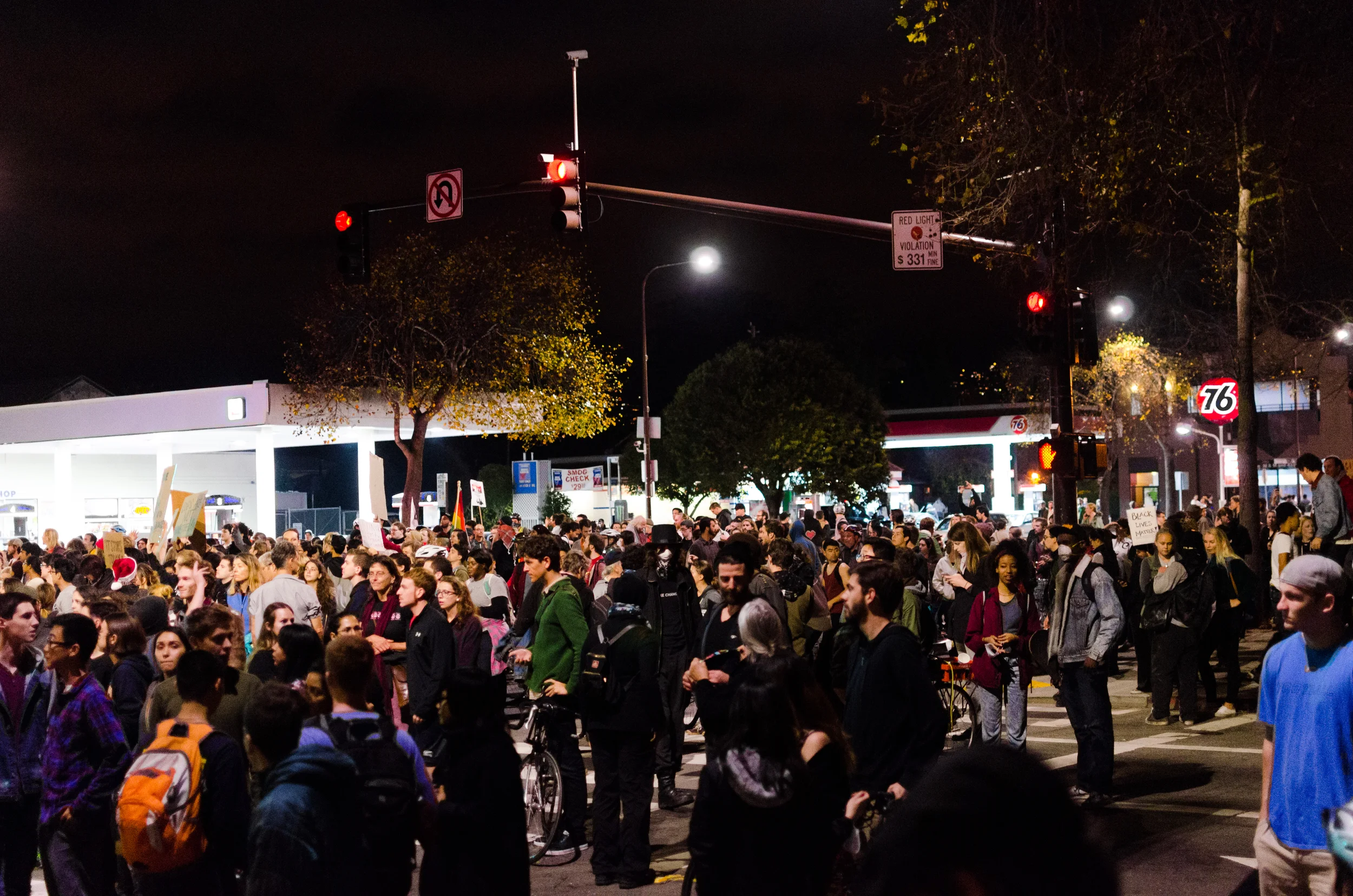Some of the crowd gathered at University and 6th street in Berkeley being blocked from the bridge by a police line - photo by Kyle Cameron
