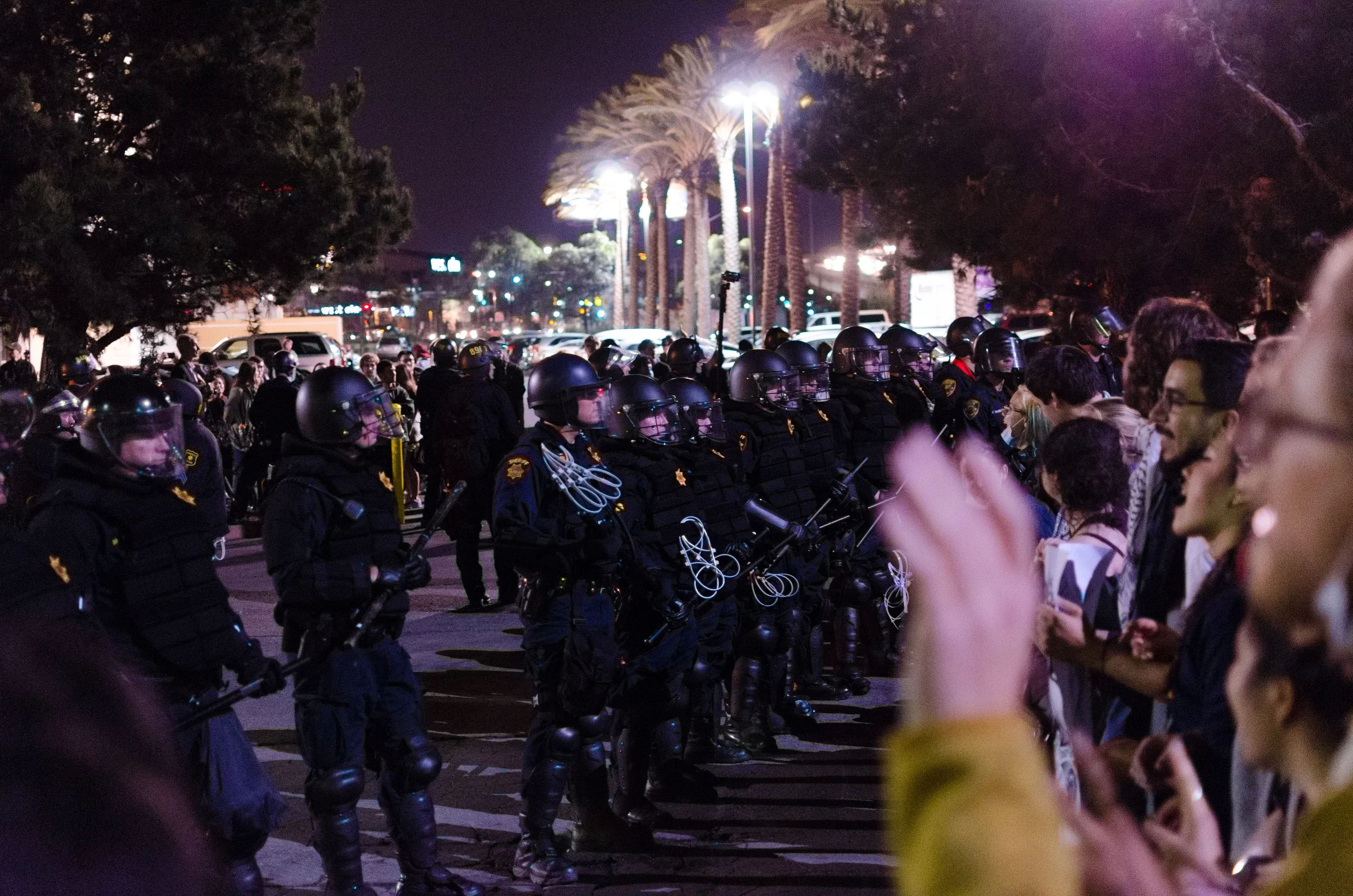 Protesters singing while trapped between police lines. At this point, officers still refused to say what was happening, but it was fairly obvious by then - photo by Kyle Cameron