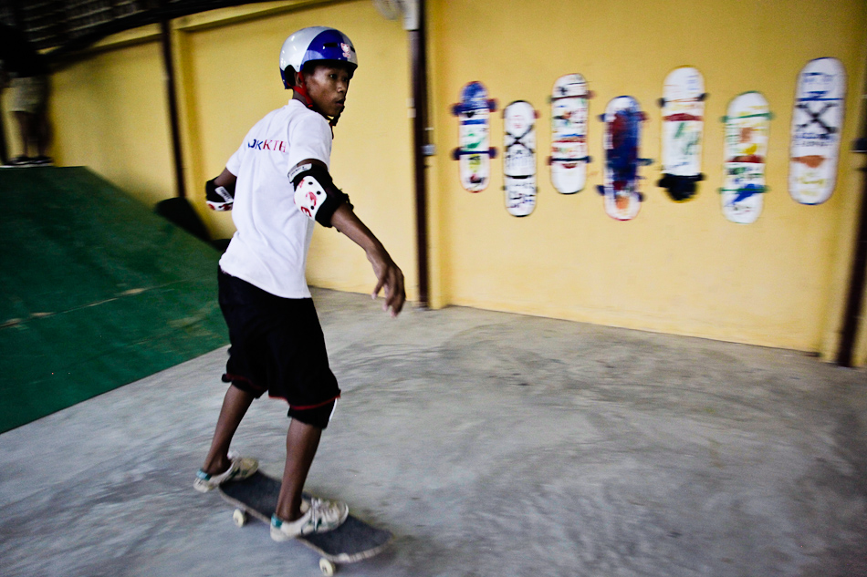  A skateboarder tries out a park run by Skateistan Cambodia, an organization that works with at-risk street kids. 