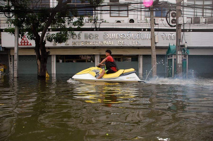  Residents in a flooded Bangkok neighborhood found different methods of transportation. 