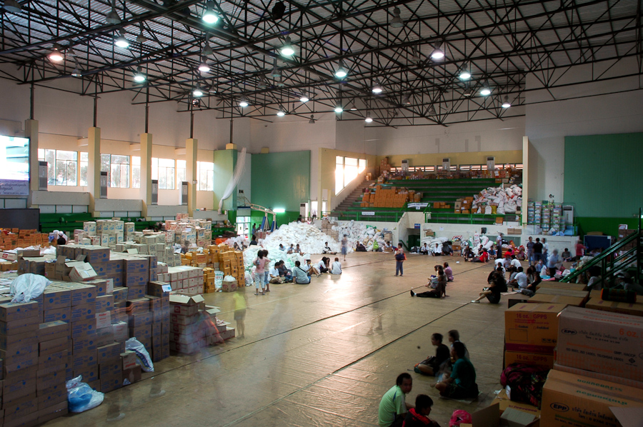  Volunteers rest at a sorting facility for donations of food and water for flood victims. 