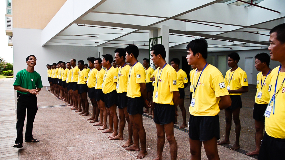  De-miners with the Cambodian Mine Action Centre (CMAC) listen to instructions during land training for the country's first underwater UXO removal team. 