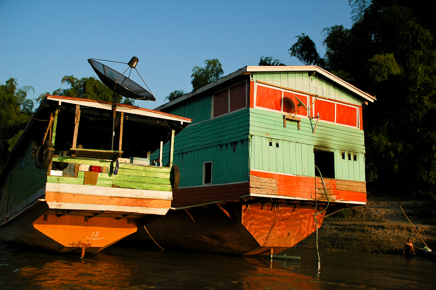  Boats along the Mekong River as sunset approaches, near Luang Prabang, Laos. 