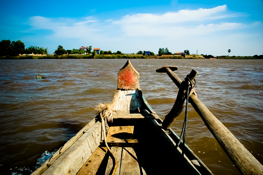 A fishing boat points toward the shore of the banks of the Tonle Sap, a Mekong tributary. 