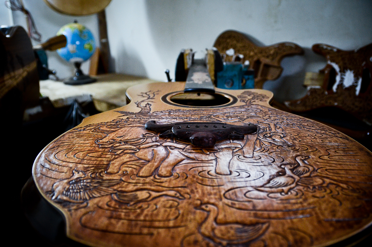 A guitar in Wayan Tuges's Bali guitar workshop nears completion.