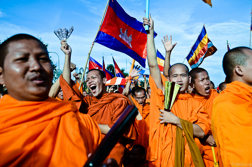  Monks celebrate when an opposition party member announces the results of negotiations with the ruling party, during an opposition-led protest September 16, 2013. 