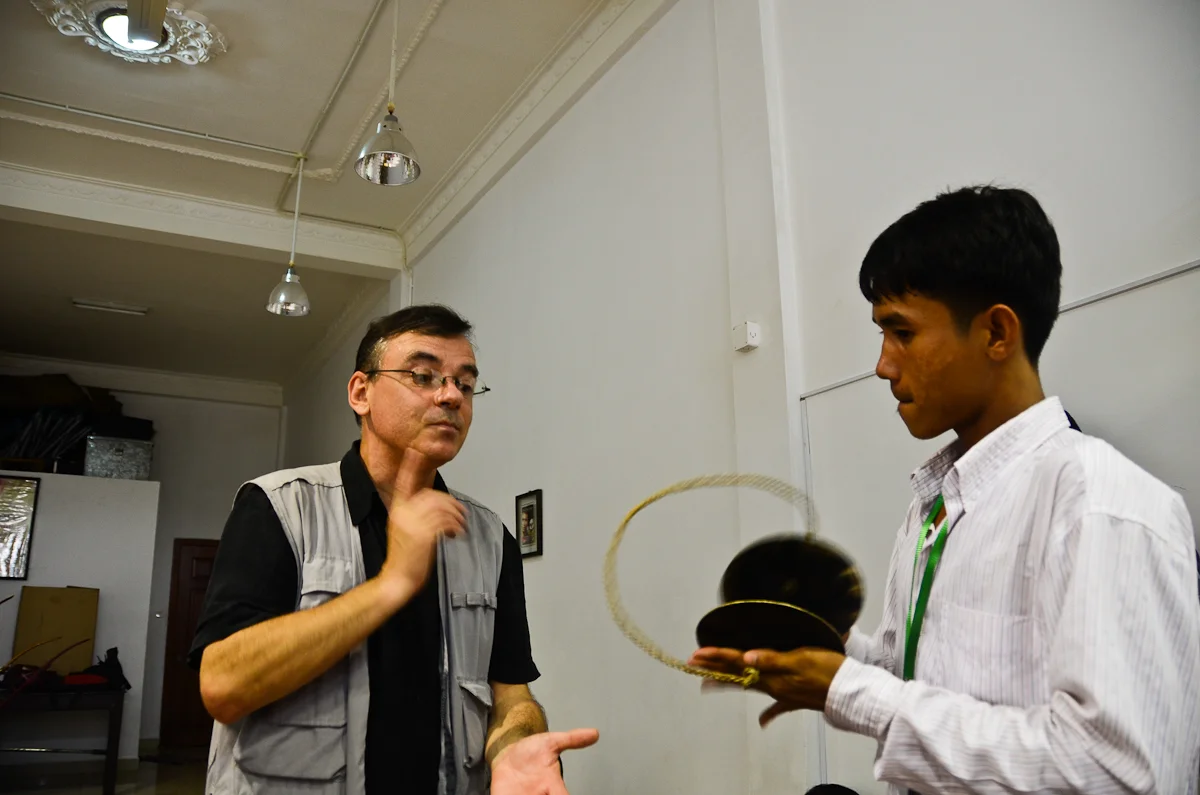 Patrick Kersalé, left, works with a musician at the Cambodian Living Arts rehearsal studio in Phnom Penh.