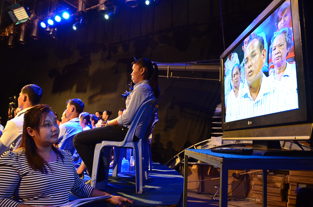  The show's producer Prak Sokhayouk, watches the screen as taping begins for 'It's Not a Dream'. 