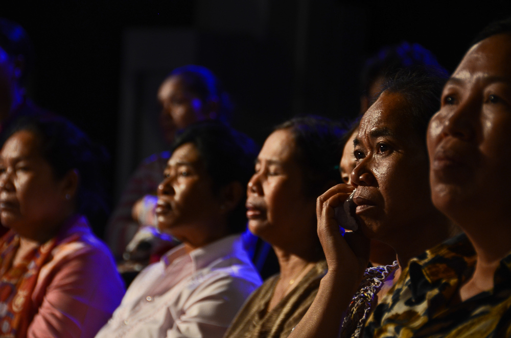  Audience members watch a taping of the Cambodian reality television show, 'It's Not a Dream.' The show re-unites families separated by the Khmer Rouge. Many among the audience have been through similar experiences. 