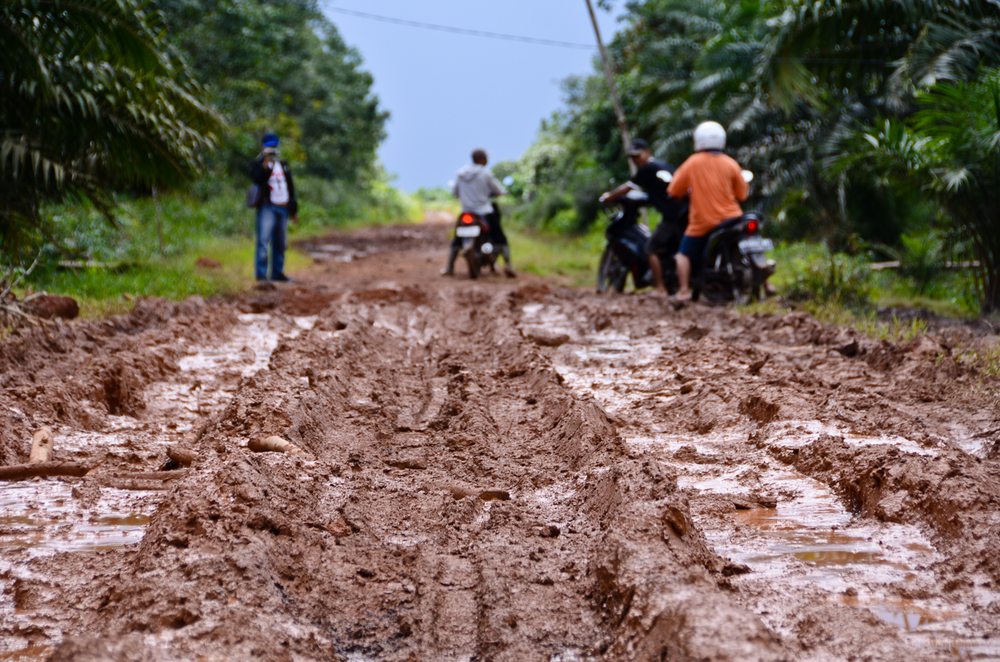  The only road leading to Adrianus' village is muddy and at times impassable during the rainy season. 