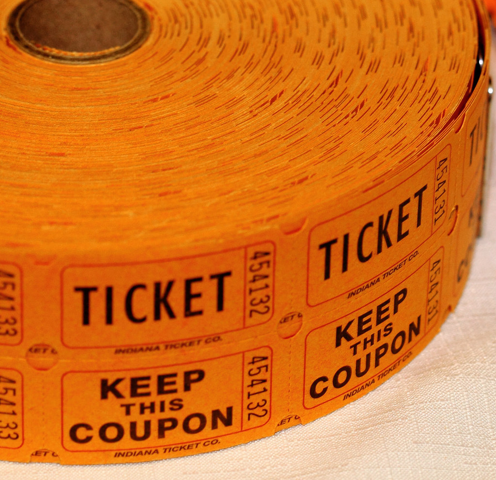 Raffle tickets rolled up waiting to be handed out.