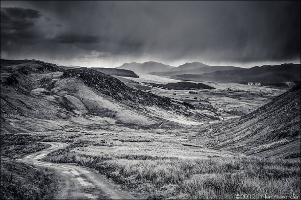 View down the valley to Ffestiniog with Trawsfynydd power station in the distance