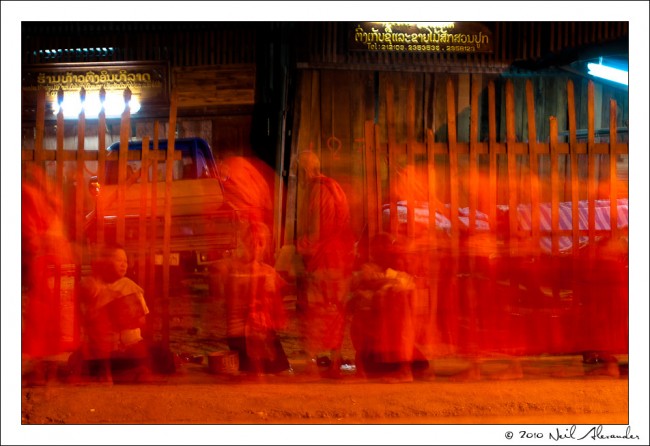 L ong exposure shot of Monks in Luang Prabang by Neil Alexander