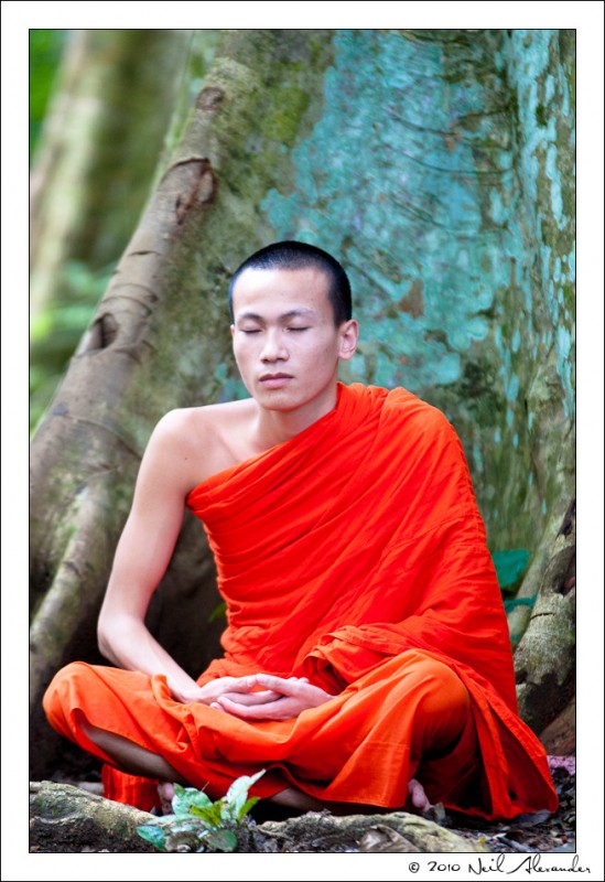 A young monk at the top of Khouangsi waterfall by Neil Alexander
