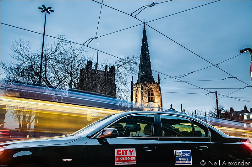 City taxi outside Sheffield town hall at night