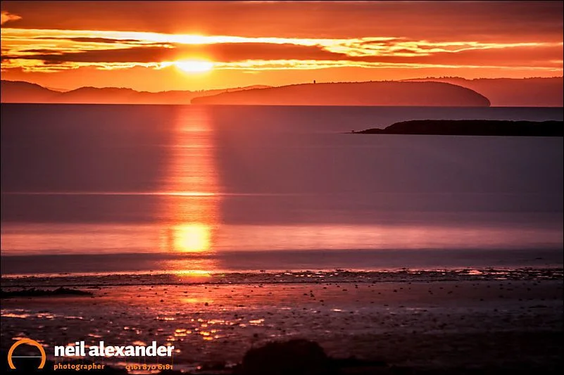 Traeth Bychan in Anglesey. Using The Photographer's Ephemeris I knew exactly where and when the sun would rise over the beach. Then it was simply a case of praying for the clouds to part.
