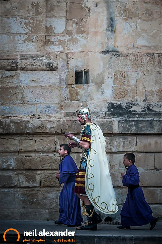 A Roman centurion on his way to the Easter parade in Zejtun, Malta with his boys