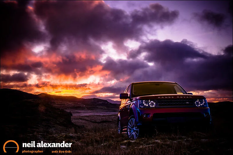 Range Rover Sport in the Welsh hills at dawn