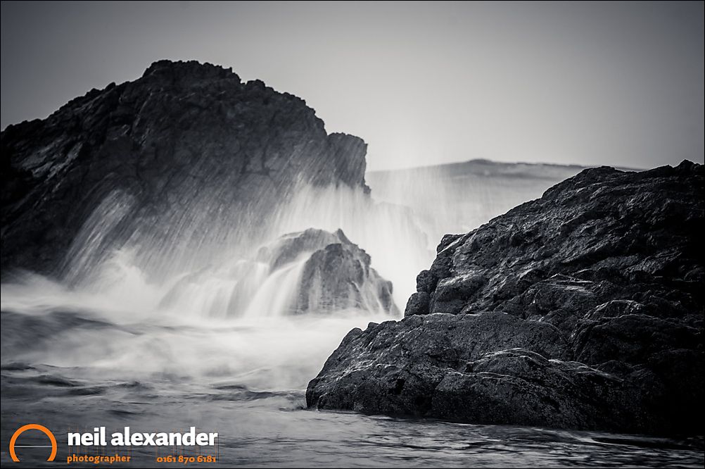 Waves crashing on the Rhosneigr beach, Anglesey, Wales, UK. amera settings: F8, 1/3 sec, ISO 200. 200mm, Singh Ray Vari-ND