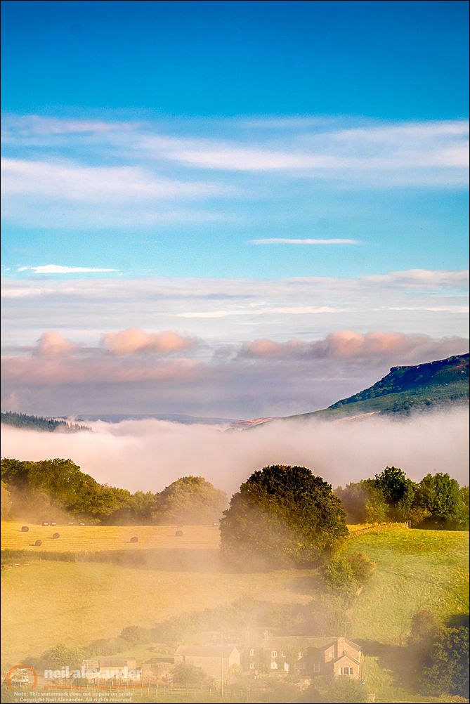Misty sunrise over the Derwent Valley looking towards Hallam Moors in the High Peaks